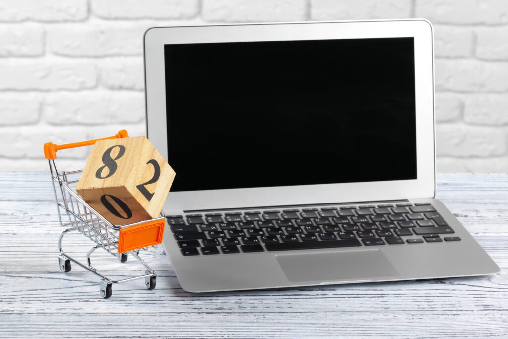 Banner depicts a laptop with a shopping cart