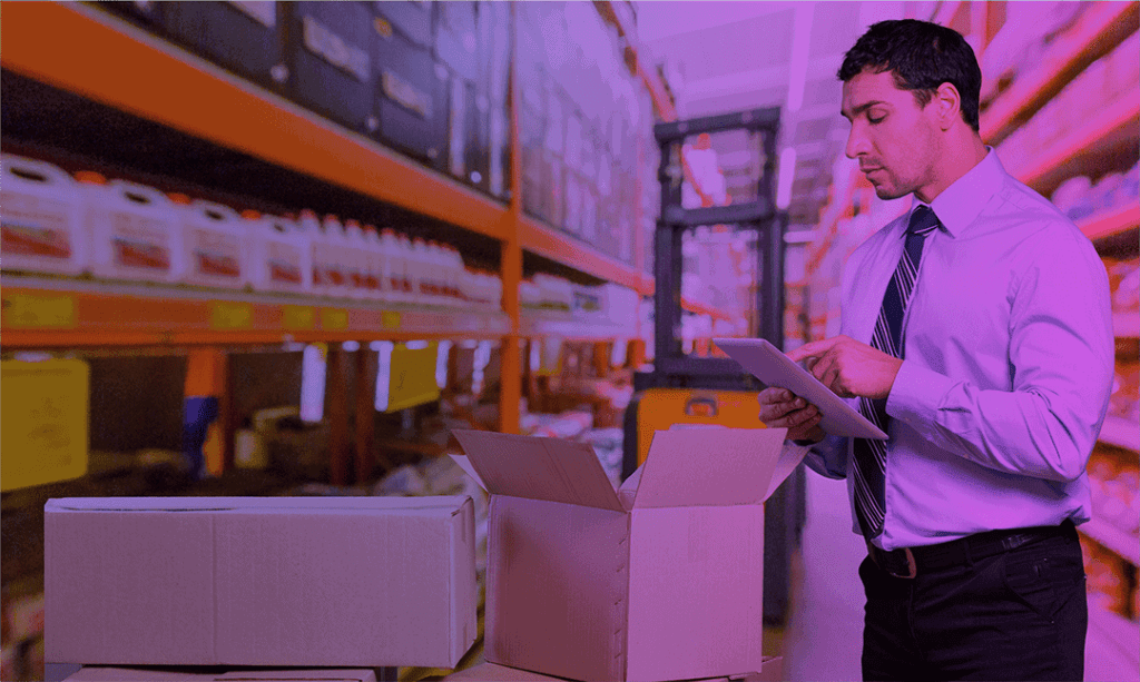 Image depicts a worker checking out Warehouse essentials