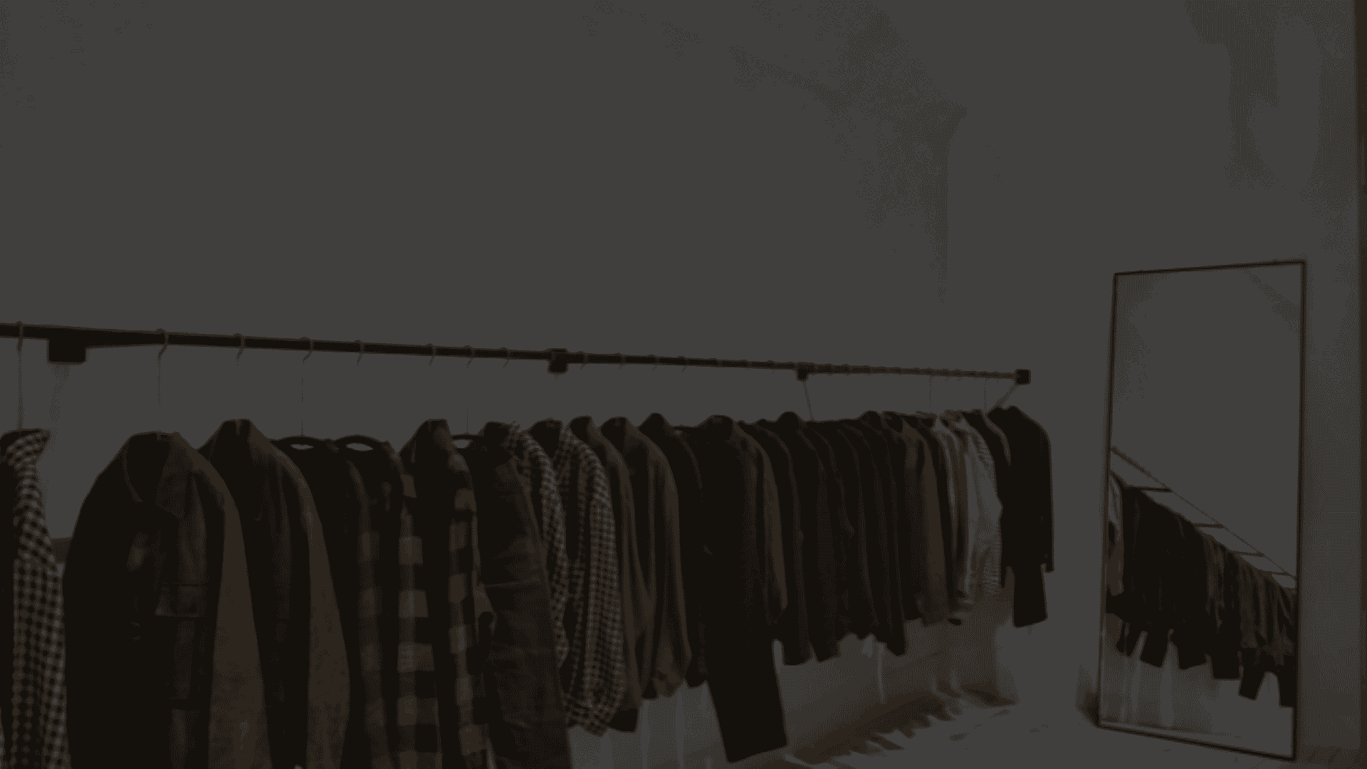 various apparels arranged together on a hanger at a retail store.