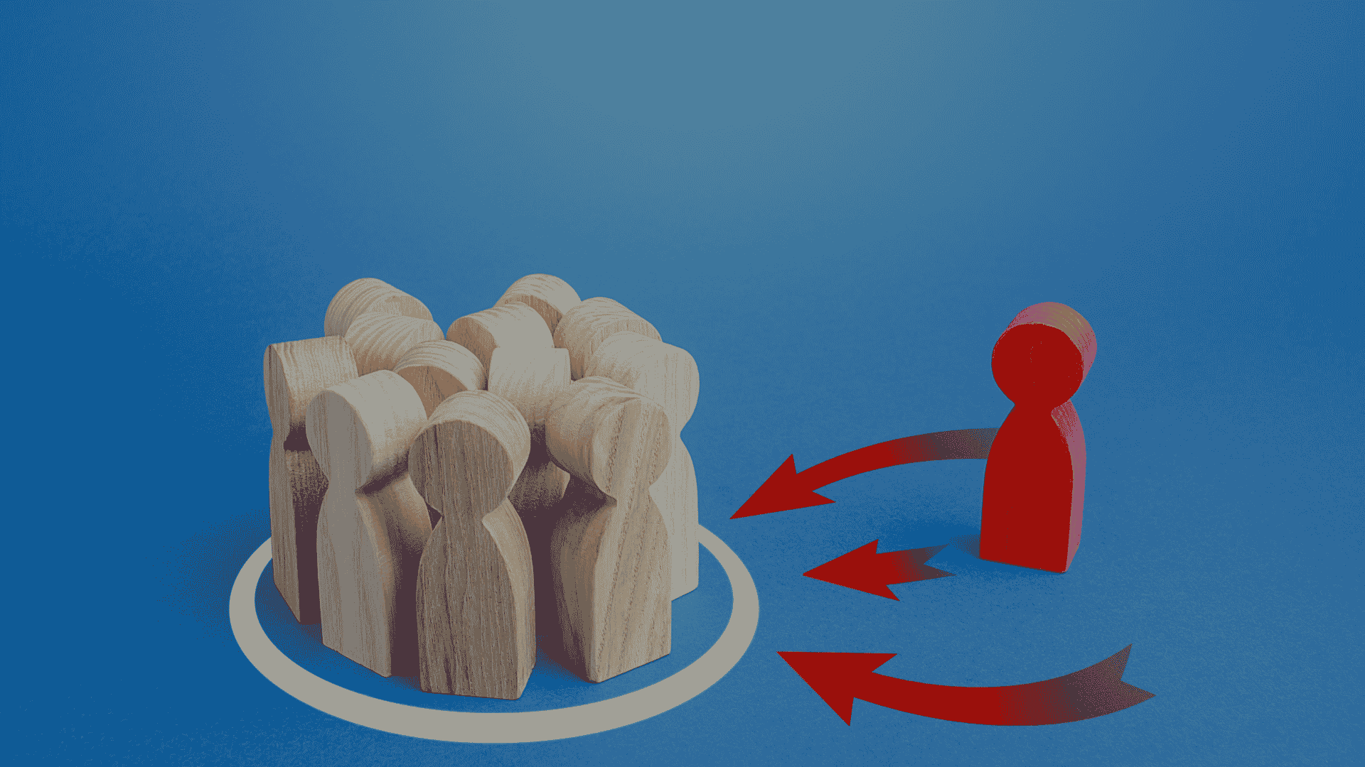 A red wooden figure stands apart from a group of natural wood figures enclosed in a circle, with red arrows pointing toward the group