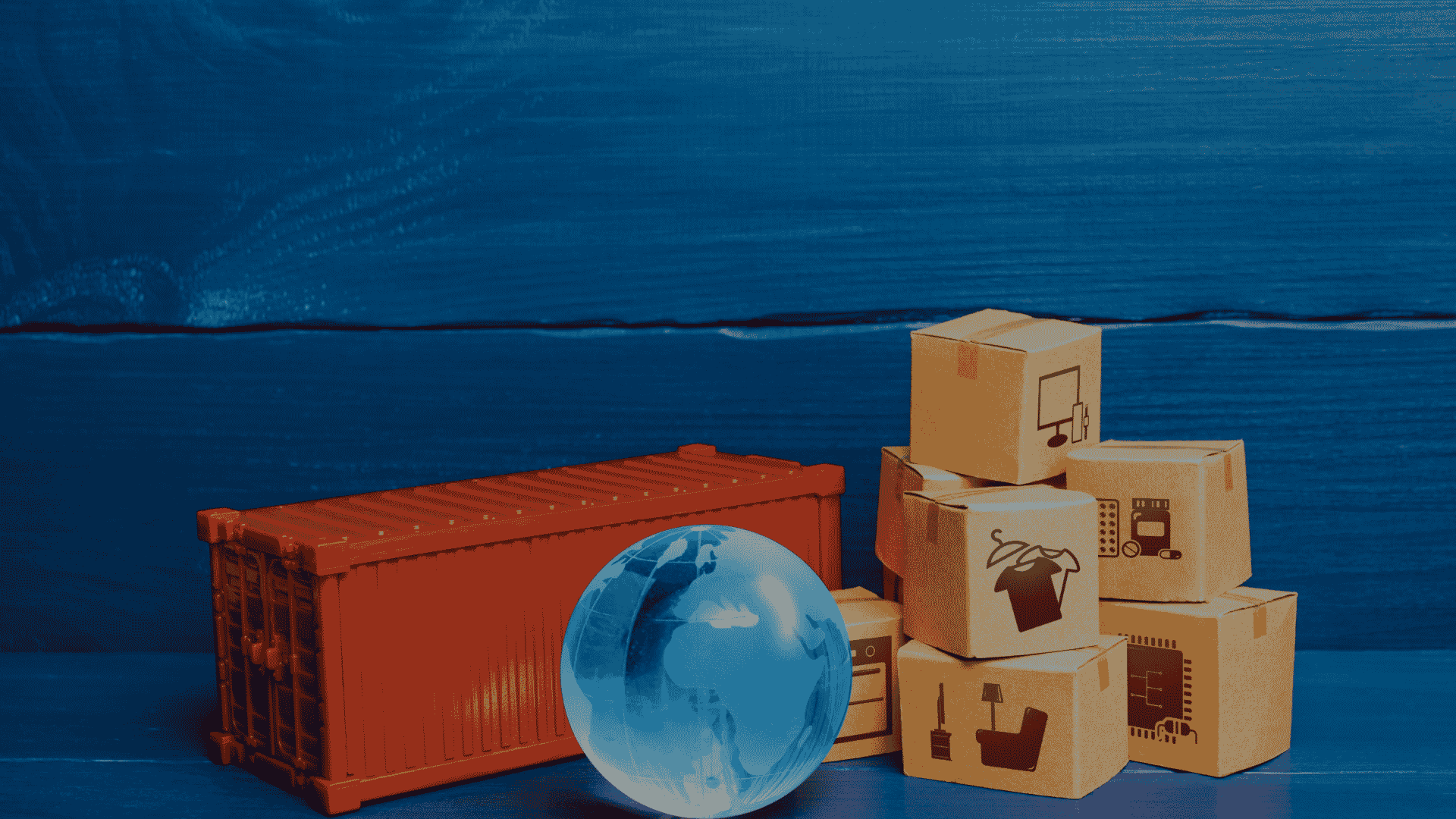 A red toy shipping container, a blue glass globe and a stack of cardboard boxes with product icons, set against a blue wooden background.