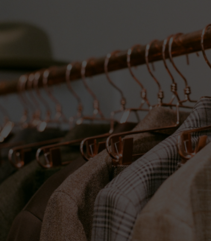 Image depicts a number of coats resting on a hanger